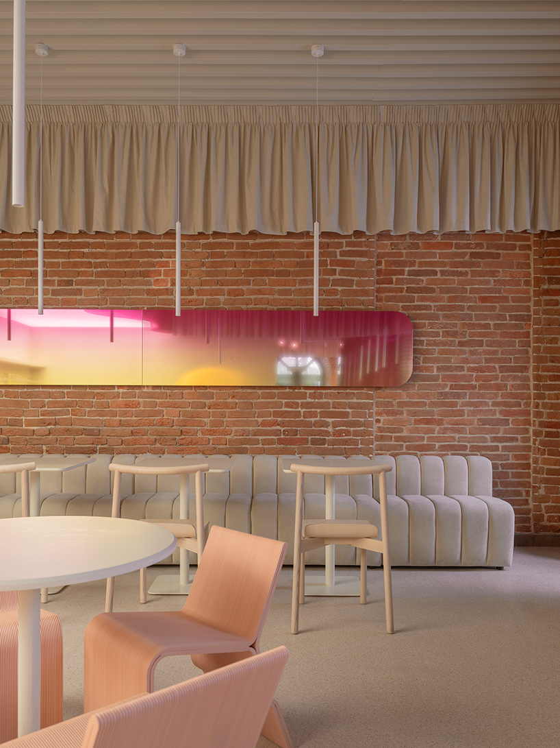 curved pink interiors animate hybrid retail-caf&eacute; space within brick shell - 5