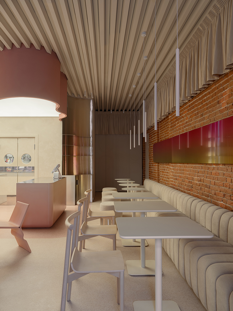 curved pink interiors animate hybrid retail-caf&eacute; space within brick shell - 6