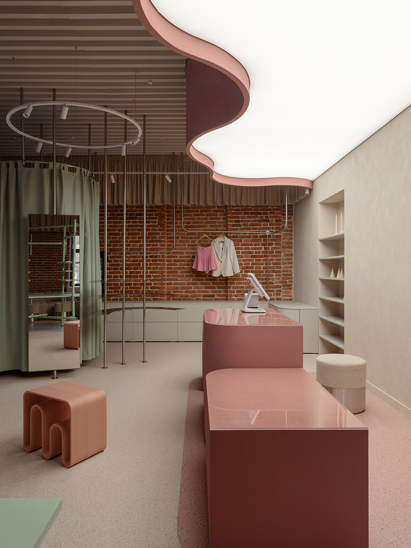 curved pink interiors animate hybrid retail-caf&eacute; space within brick shell - 8