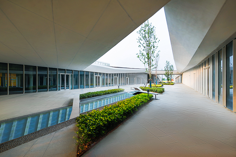 radiating paving and green roofs recast xuzhou rail station as urban gateway and public realm - 10