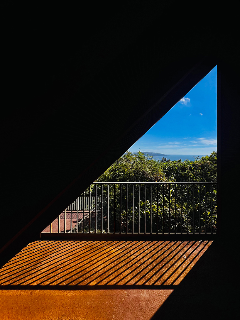 corten-clad twin pavilions frame shifting sea views along chinese coastal valley - 8