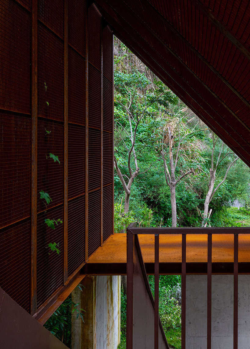 corten-clad twin pavilions frame shifting sea views along chinese coastal valley - 9