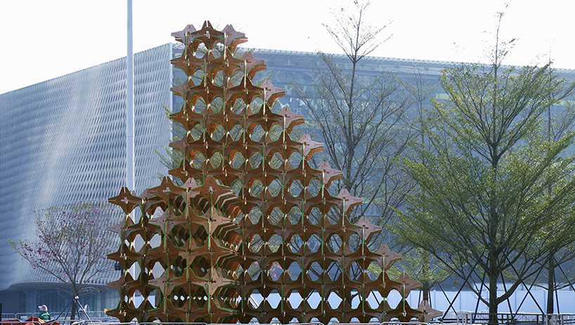 hundreds of interlocking star modules build a porous timber installation - 5