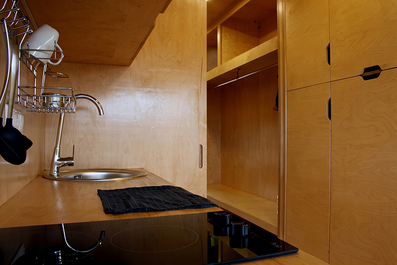 repurposed shipping container becomes 24-sqm birch plywood micro-cabin - 8