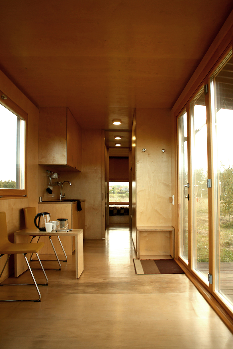 repurposed shipping container becomes 24-sqm birch plywood micro-cabin - 4