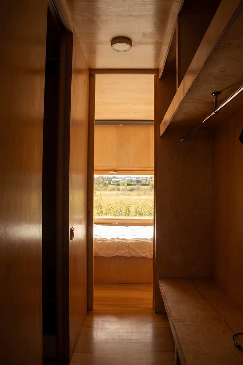 repurposed shipping container becomes 24-sqm birch plywood micro-cabin - 6