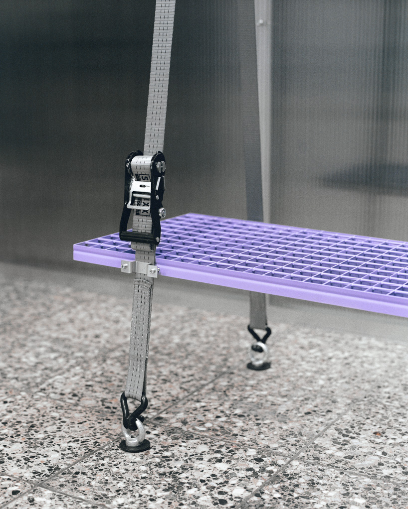 steel grates suspended from ratchet straps turn into furniture for bratislava photo lab - 11