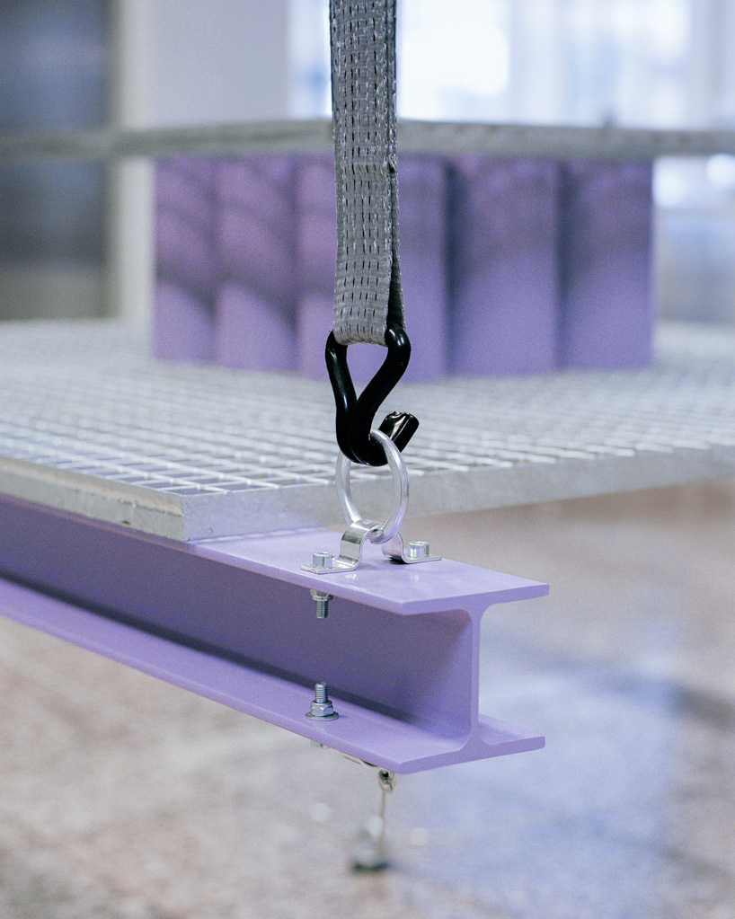 steel grates suspended from ratchet straps turn into furniture for bratislava photo lab - 12