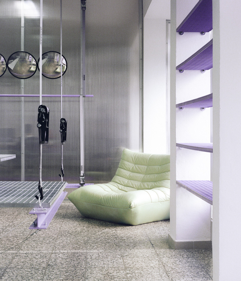 steel grates suspended from ratchet straps turn into furniture for bratislava photo lab - 7