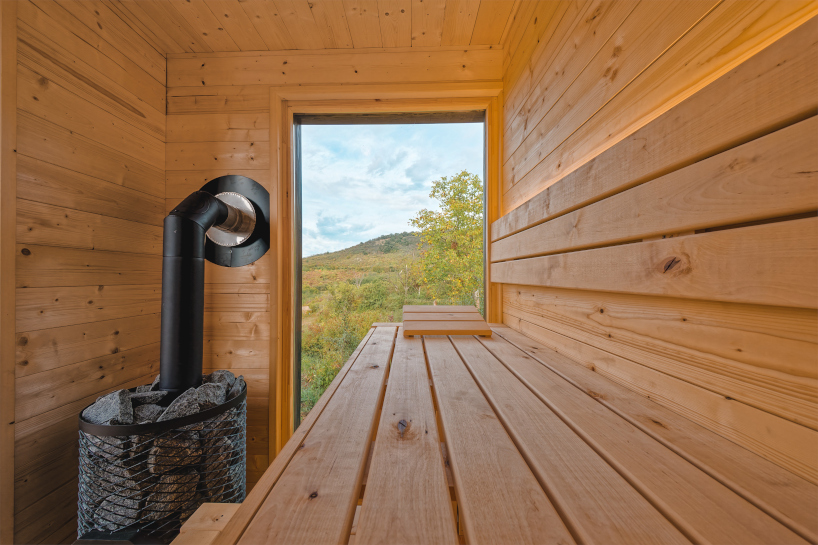 prefabricated timber micro-cabin extends living into the hungarian landscape - 8