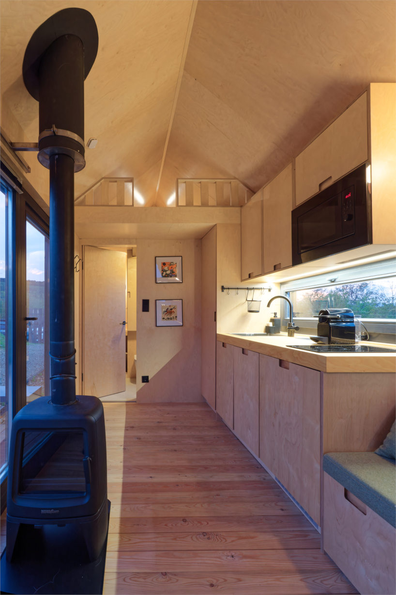 prefabricated timber micro-cabin extends living into the hungarian landscape - 6
