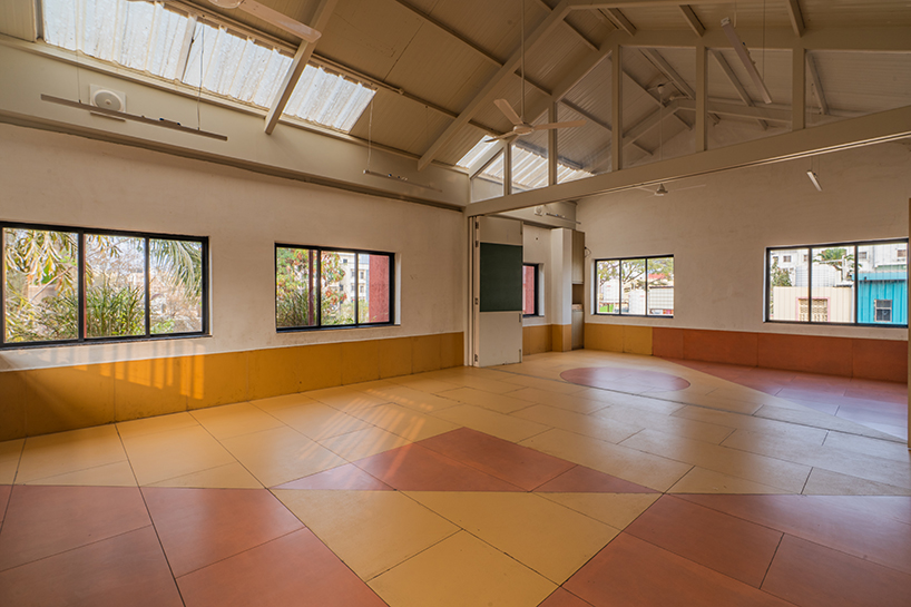 underused house reconfigures into child-centered bright red preschool in india - 8
