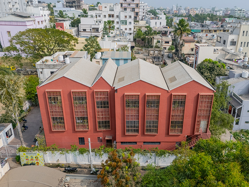 underused house reconfigures into child-centered bright red preschool in india - 1