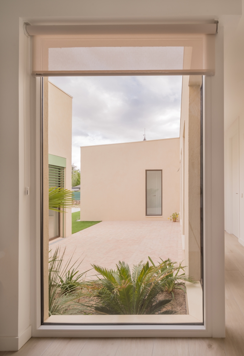 casa violetas balances enclosure and openness through courtyard living in madrid - 8