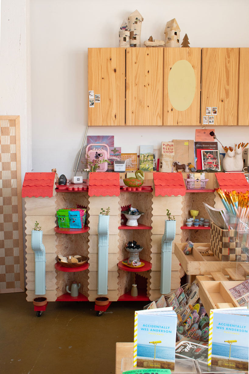 modular timber display rooms reinterpret the checkout counter as an open house facade - 11