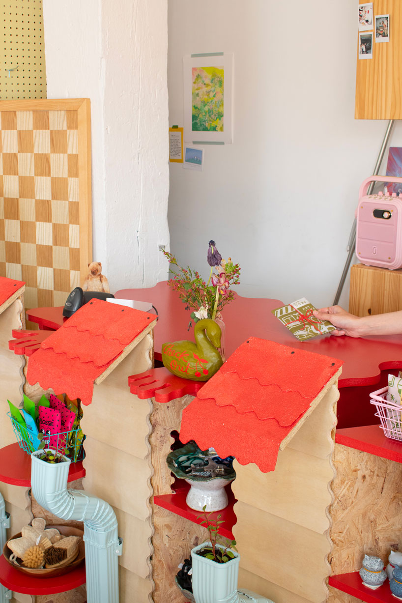 modular timber display rooms reinterpret the checkout counter as an open house facade - 4