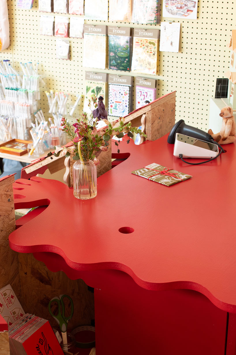 modular timber display rooms reinterpret the checkout counter as an open house facade - 8