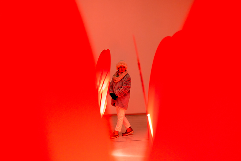 translucent red acrylic tulips form a glowing participatory light and sound installation - 6