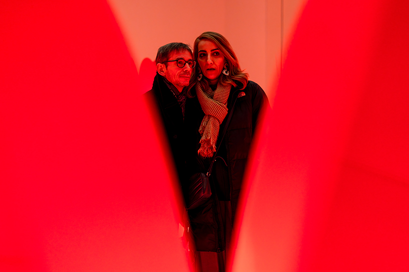 translucent red acrylic tulips form a glowing participatory light and sound installation - 7