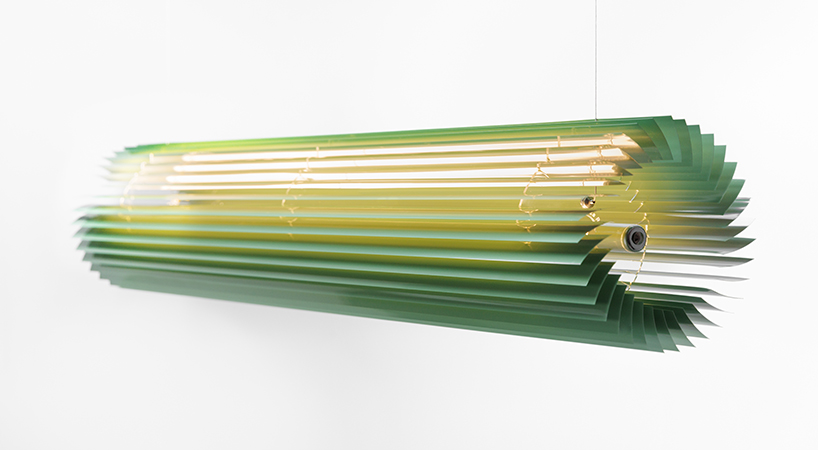 discarded aluminum blinds transform into cylindrical lighting system - 1