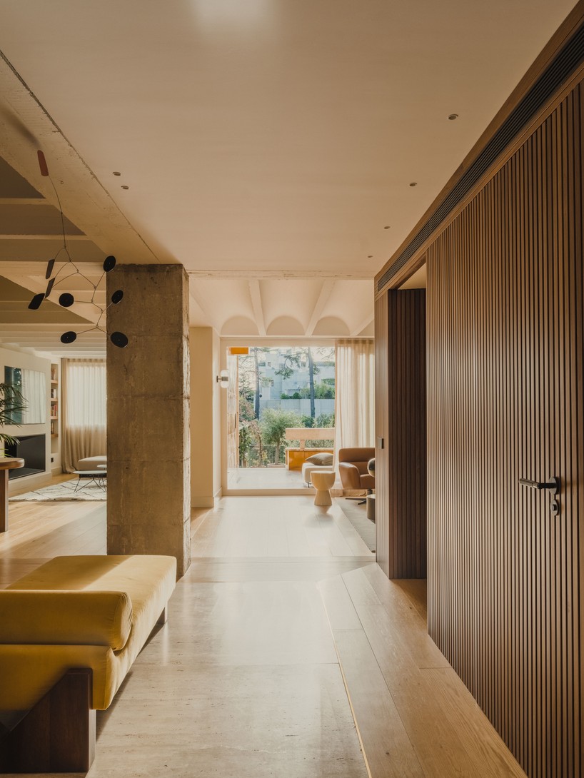 red microcement pairs with onyx marble to reframe brutalist barcelona duplex - 4