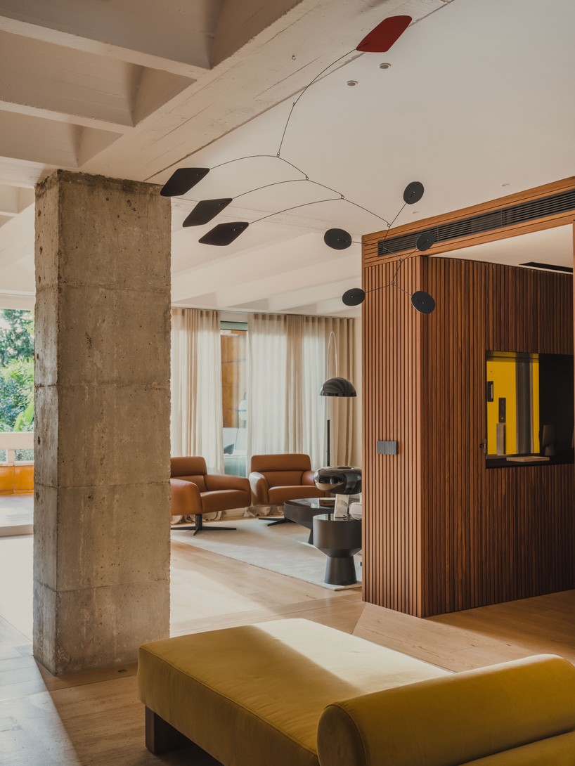 red microcement pairs with onyx marble to reframe brutalist barcelona duplex - 5