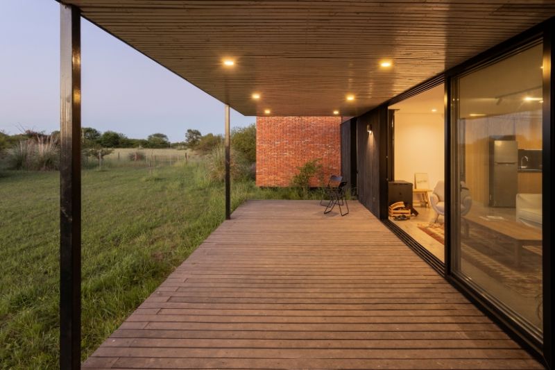 monolithic brick volumes wrap weekend house around a series of courtyards in argentina - 9