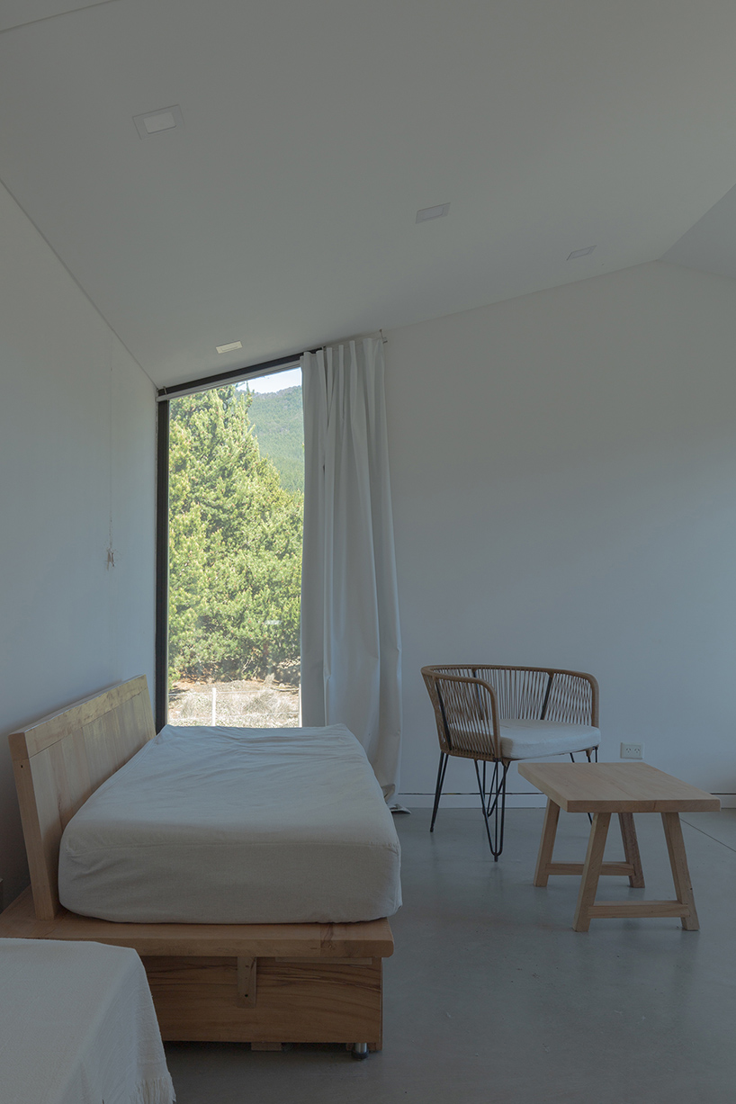 a modular cabin stands between river, forest, and mountains in argentine patagonia - 6