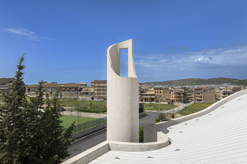 a flowing roof and fluid concrete walls frame the new santa barbara parish complex in sicily - 6