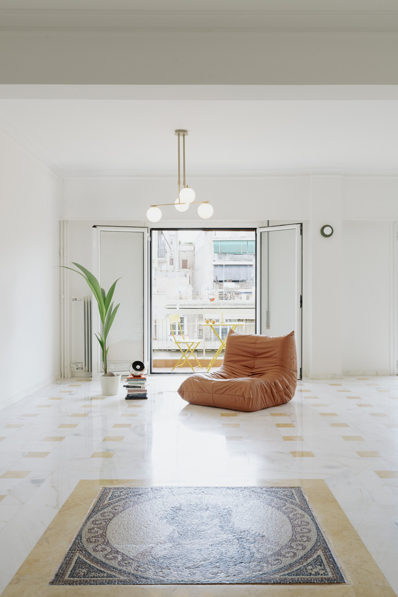 bacchus floor mosaic inspires yellow terrazzo and marble apartment renovation in athens - 2