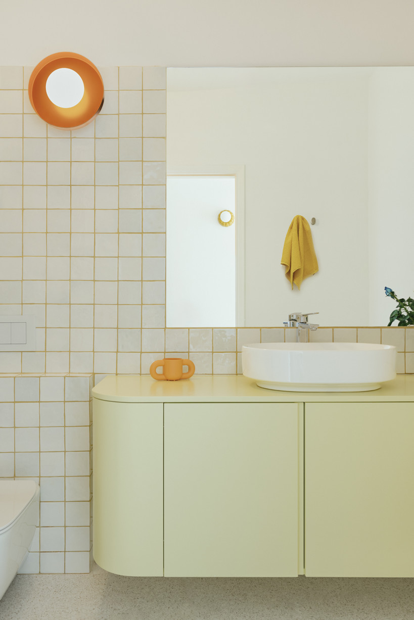 bacchus floor mosaic inspires yellow terrazzo and marble apartment renovation in athens - 10