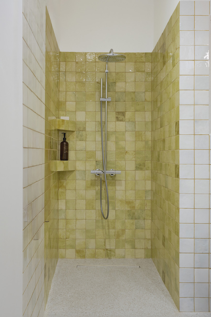 bacchus floor mosaic inspires yellow terrazzo and marble apartment renovation in athens - 11