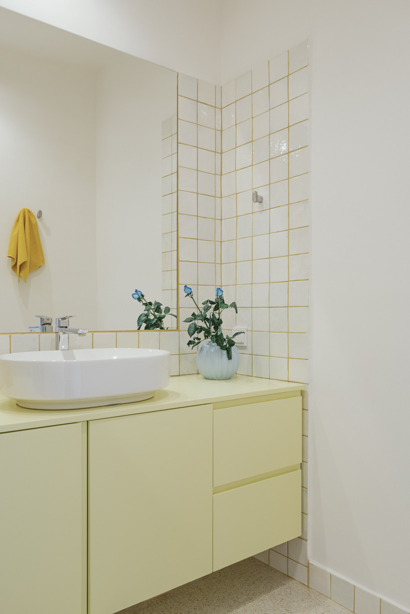 bacchus floor mosaic inspires yellow terrazzo and marble apartment renovation in athens - 12
