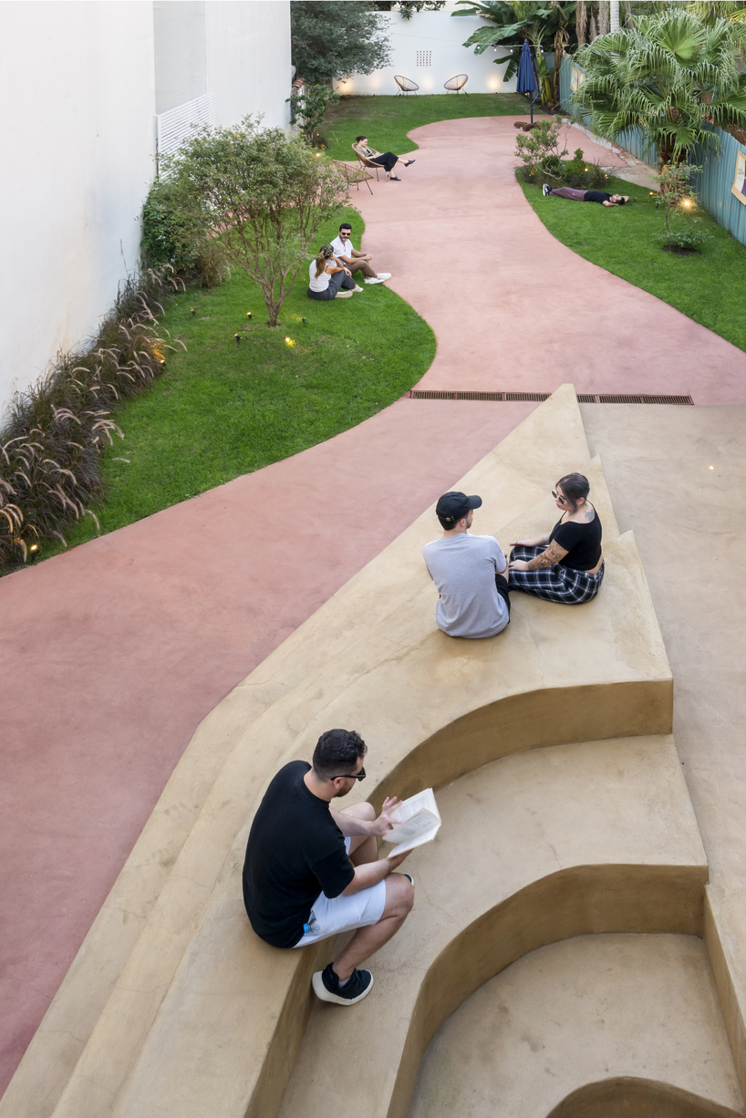 exposed brick and blue metal transform a 1930s brazilian house into a cultural art hub - 9