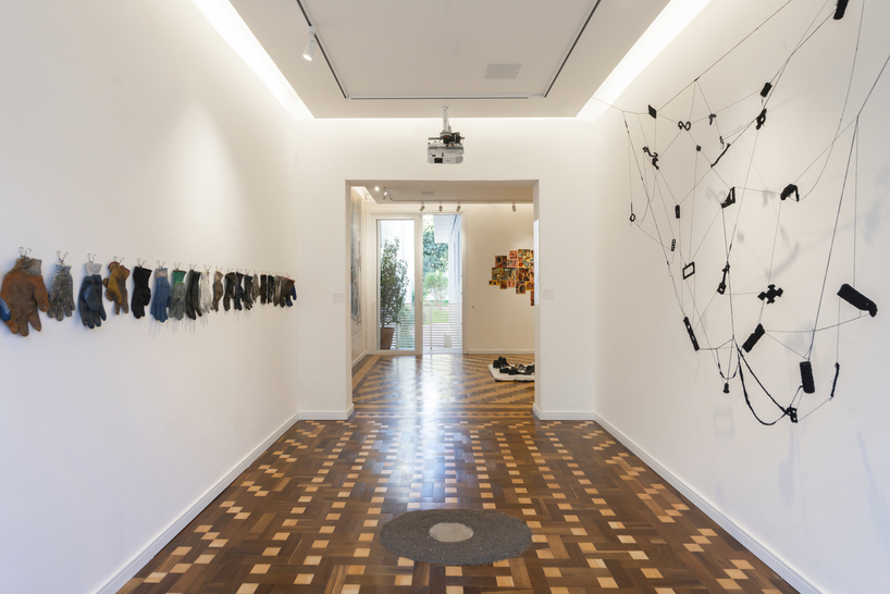 exposed brick and blue metal transform a 1930s brazilian house into a cultural art hub - 4