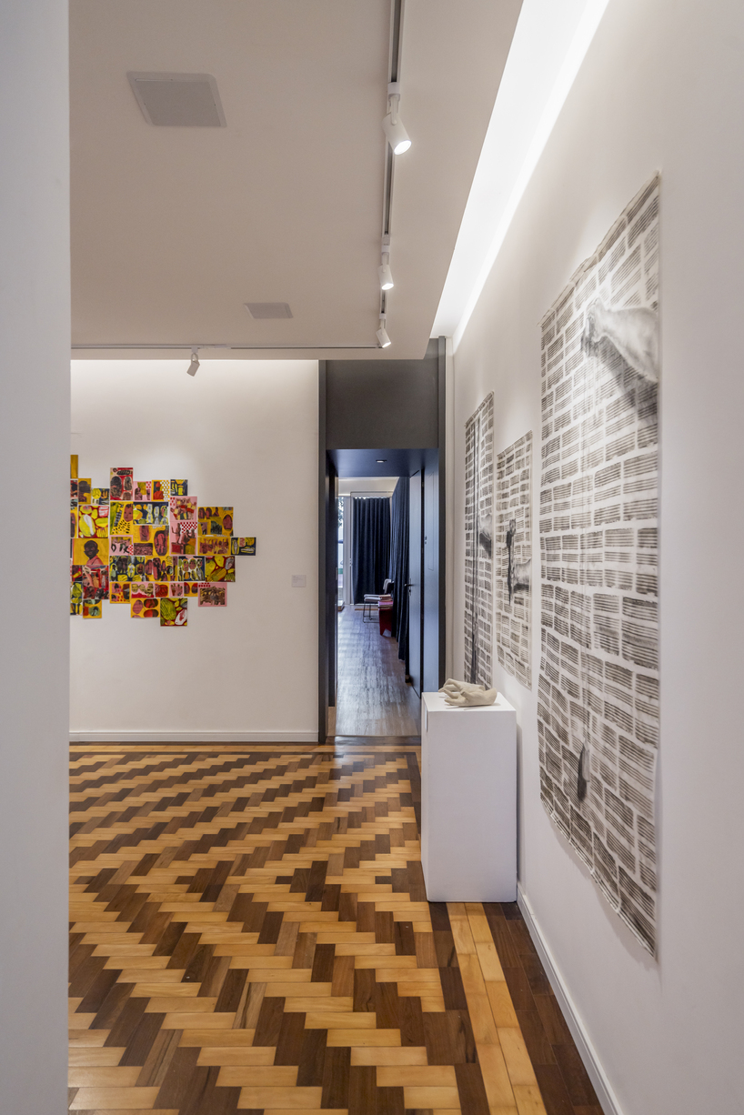 exposed brick and blue metal transform a 1930s brazilian house into a cultural art hub - 5