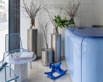 colorful furnishings and raw textures animate an open-plan flower shop