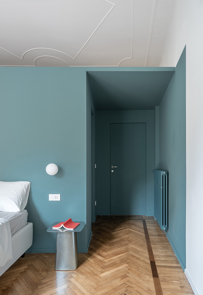 folded yellow volume reorganizes genova apartment’s interiors like a game of tetris - 11