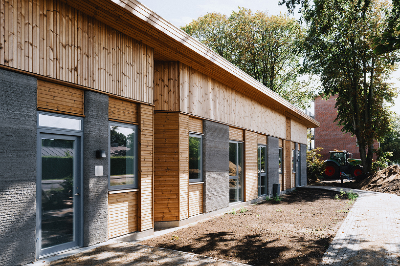 3D printed concrete and cork shape 36 student homes in denmark - 2