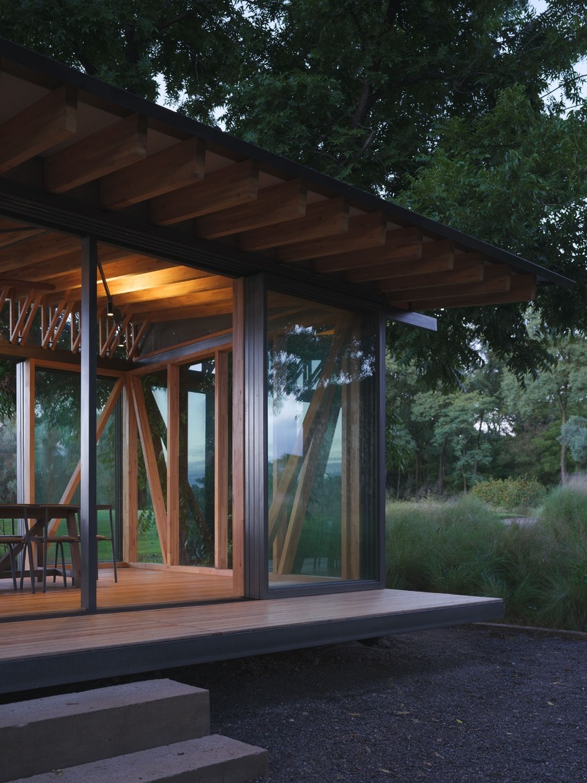 rhythmic timber and glass pavilion unfolds beneath pecan tree canopy in argentina - 10