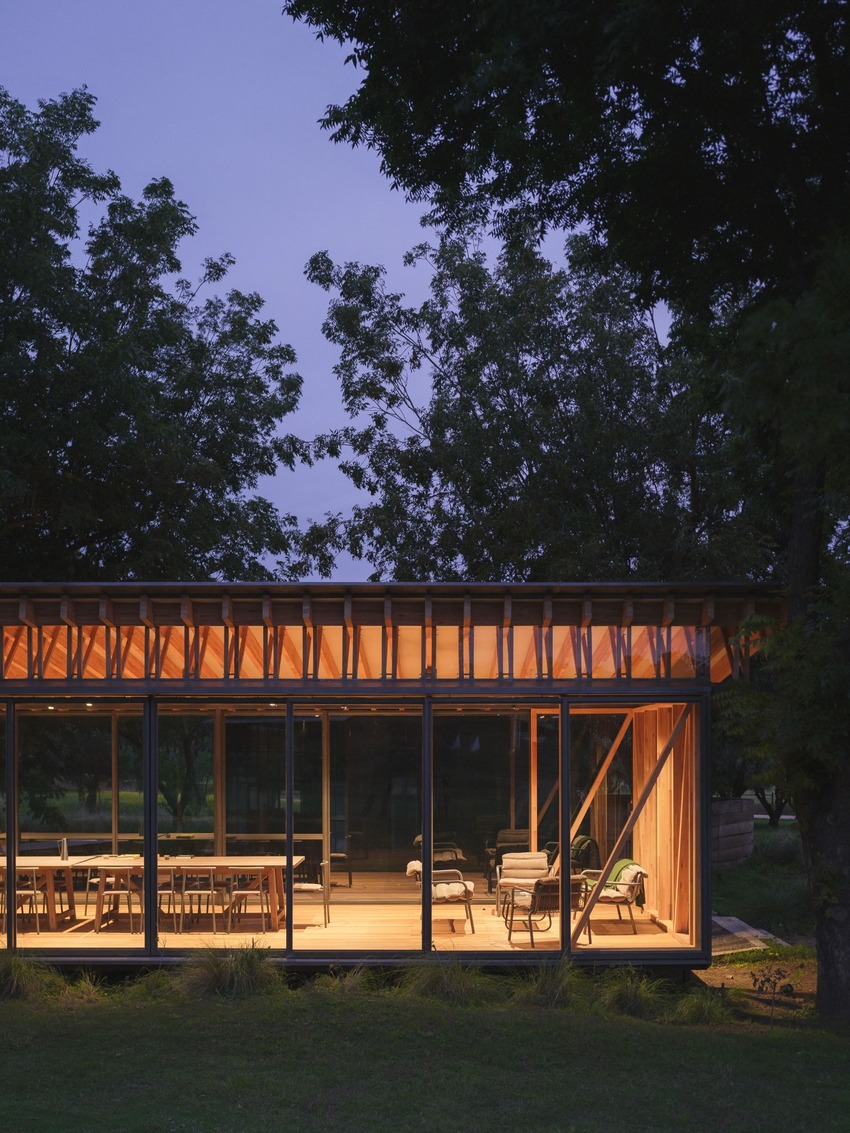 rhythmic timber and glass pavilion unfolds beneath pecan tree canopy in argentina - 11