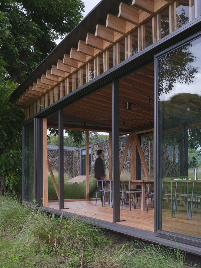 rhythmic timber and glass pavilion unfolds beneath pecan tree canopy in argentina - 8
