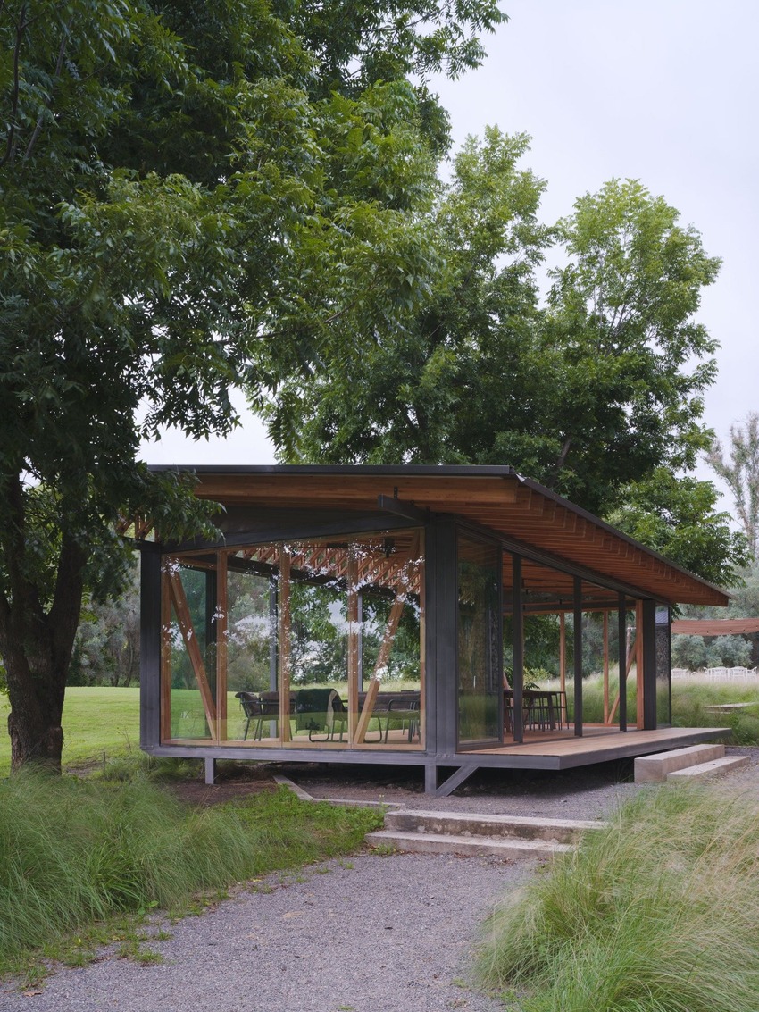 rhythmic timber and glass pavilion unfolds beneath pecan tree canopy in argentina - 9