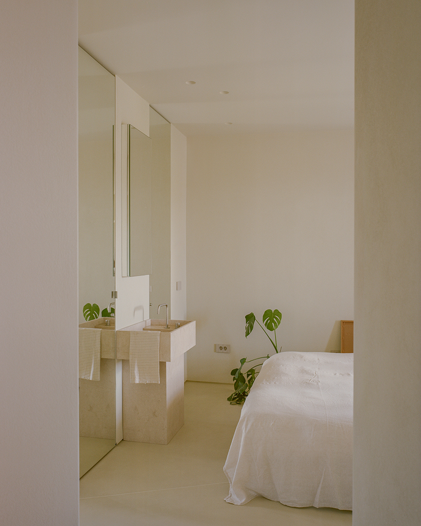 a series of joinery elements replaces walls in 1970s athens apartment renovation - 11