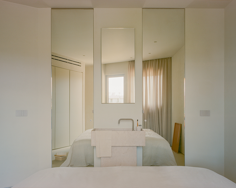 a series of joinery elements replaces walls in 1970s athens apartment renovation - 12