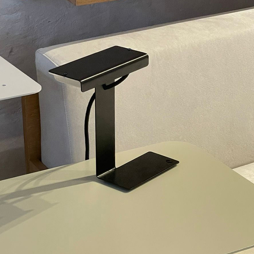 single sheet of folded steel sculpts into z-shaped table lamp - 8