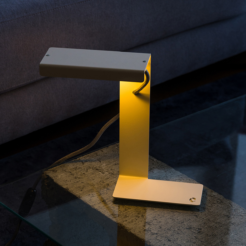 single sheet of folded steel sculpts into z-shaped table lamp - 9