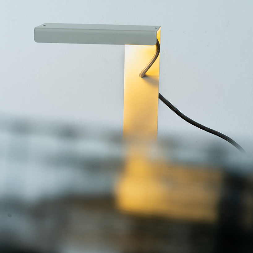 single sheet of folded steel sculpts into z-shaped table lamp - 7