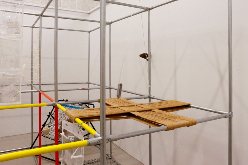 metal pipe grid transforms personal rituals of control into participatory playground - 7