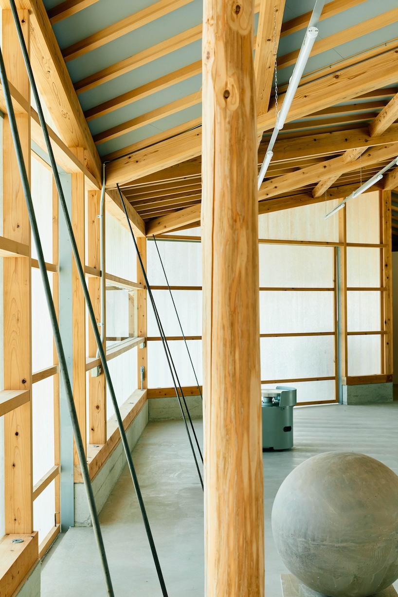 triangular timber structure encloses tsukumo kiln ceramic studio in kobe, japan - 8